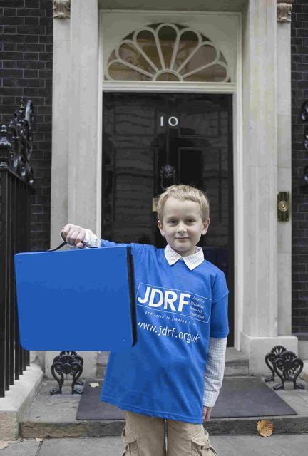 Zac Hirst hands in a petition on behalf of JDRF type one diabete