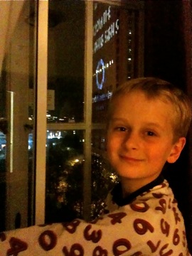 Zac ready for bed in front of his hotel window