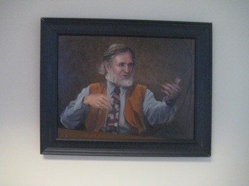 The painting of Jim Kaput by his son-in-law Glen Kessler hanging in the Kaput Center
