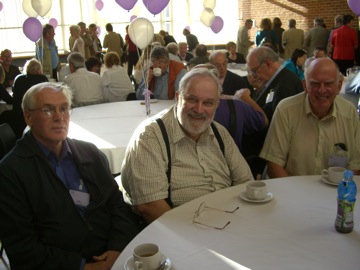 David sits between mathematicians John Haigh and Martin Dunwoody
