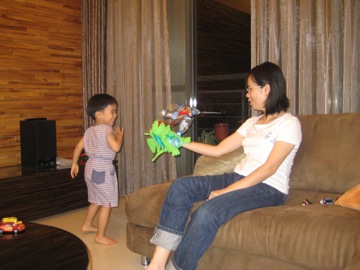 Grace plays with Cephas and the Dragon puppet brought from Kenilworth for him.