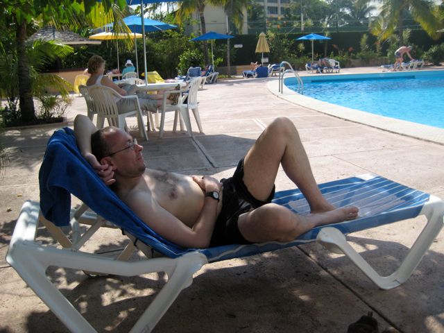 Chris relaxes by the pool in the hotel
