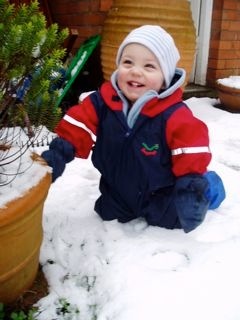 In Newark baby James plays in the snow