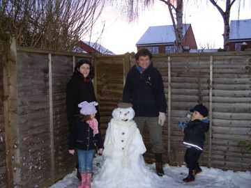 In Taunton, Janet and Nic build a snowman with Emily and Simon